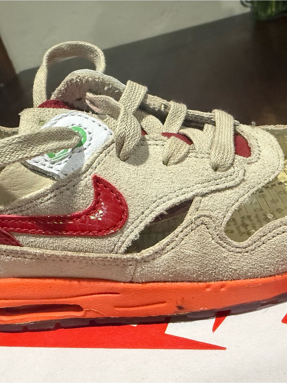 Nike Kids Beige Sneakers with Red Swoosh and Orange Sole